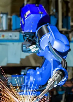 Welding robot in action Welding robot in action