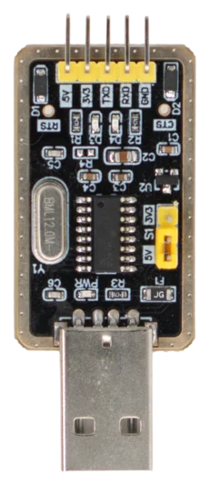 A close-up view of a microcontroller board with a USB connector. The board features various pins, components, and labels indicating power and communication connections, suitable for electronic projects and programming applications.