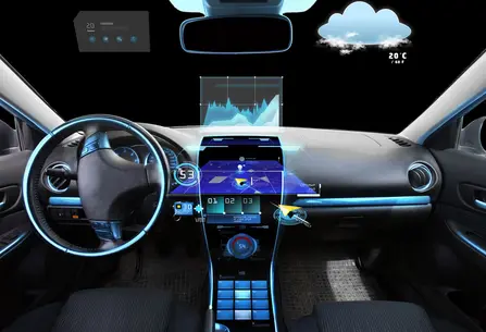 A futuristic car interior features a digital dashboard with augmented reality displays. Displays show speed, navigation maps, and weather information. The steering wheel has controls, and ambient lighting enhances the modern design. The dashboard highlights various data graphics for driving assistance.