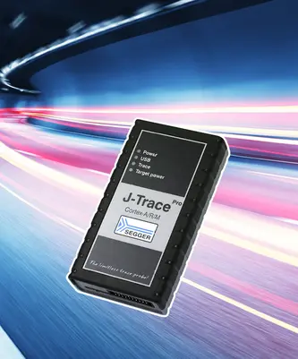 Image of a J-Trace Pro debug probe for Cortex-A/RM microcontrollers. The device is black with white text indicating "Power," "USB," "Trace," and "Target power." It is displayed against a dynamic background suggesting speed and technology, highlighting its purpose for embedded system development.