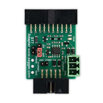 A green electronic adapter board featuring various connection pins, including JTAG and power ports. The board has multiple small components and labels indicating functionalities such as VDD, VTREF, and GND. The product is designed for programming and debugging microcontrollers.