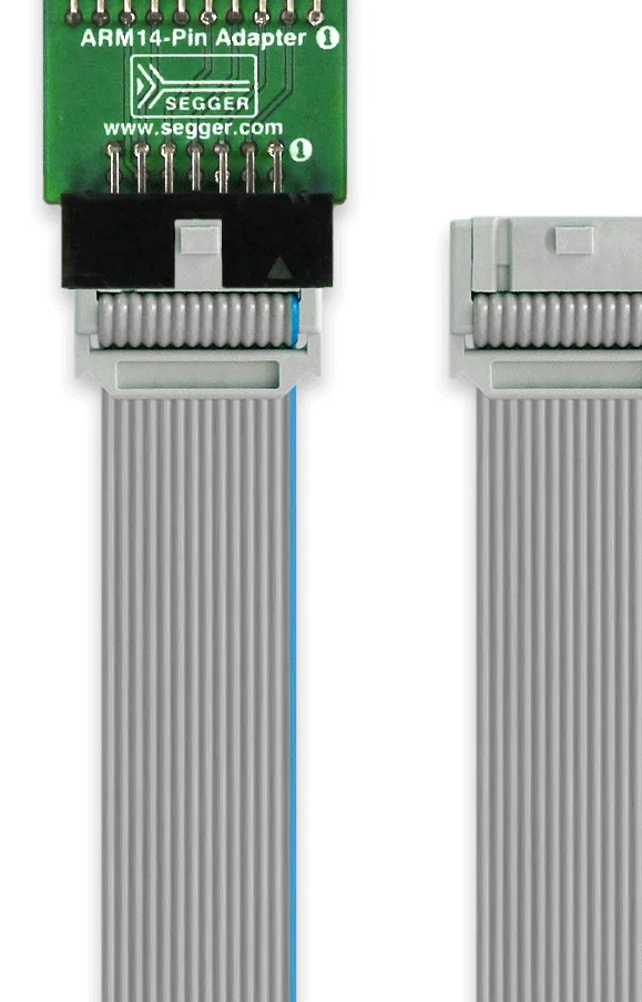 An ARM14-pin adapter with a green circuit board on top, featuring pin connectors. It is connected to a gray ribbon cable that has two connectors at either end. The adapter is for interfacing with ARM devices in electronic projects.