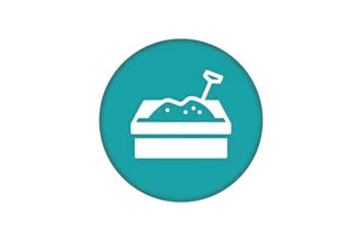 Icon of a sandbox with a shovel, set against a teal circular background. The sandbox is depicted in white, showing a mound of sand and a small shovel sticking out.