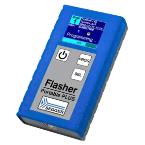 A blue, handheld programming device labeled "Flasher Portable PLUS" is shown. The device features a small screen displaying programming status and file information, along with three buttons: a power button, "PROG," and "SEL." The surface has a textured grip for ease of handling.