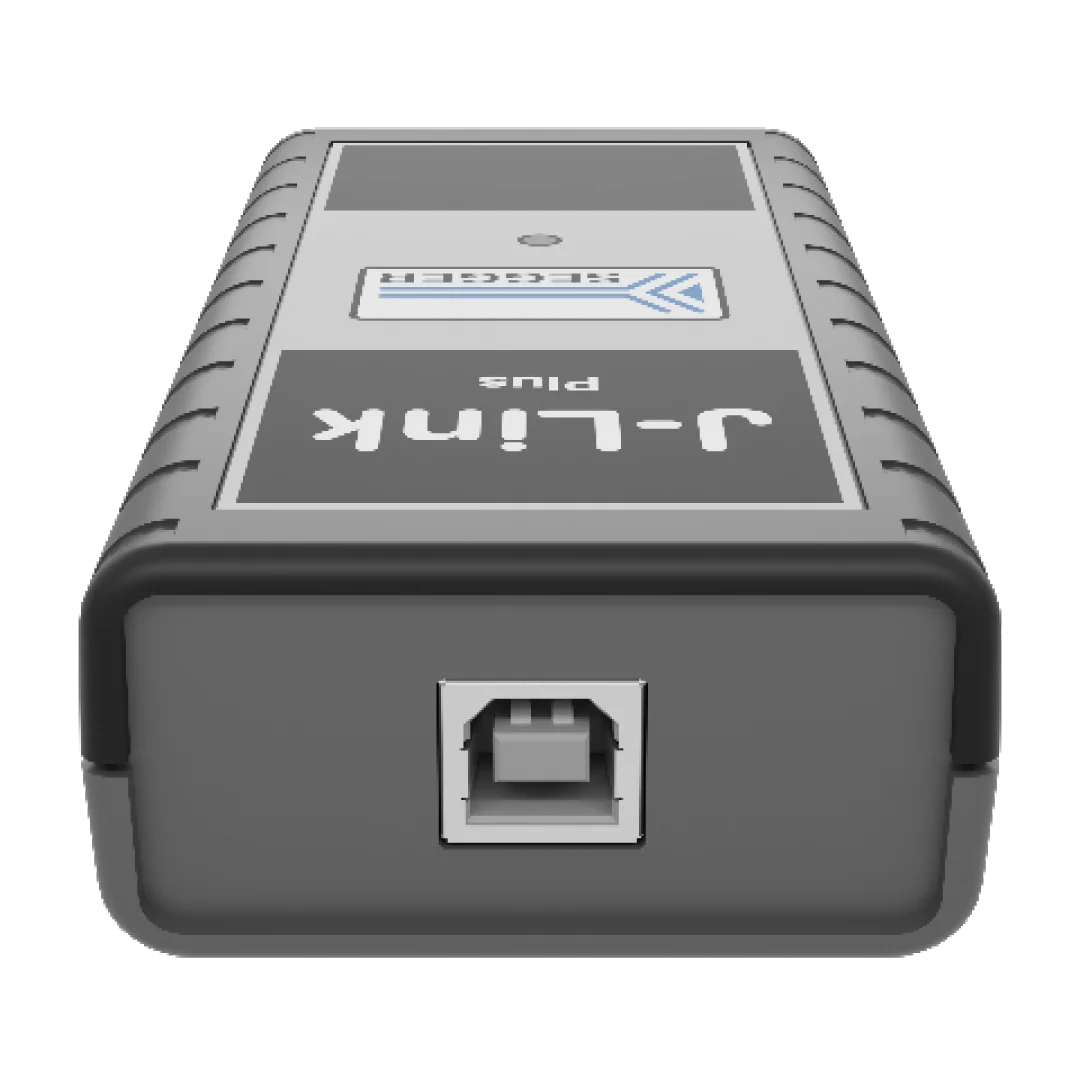 A gray electronic device with a rectangular shape. The front features a prominent USB port in the center and a label displaying "J-Link" and "Unit" above it. The device's surface has a textured grip, suggesting durability.