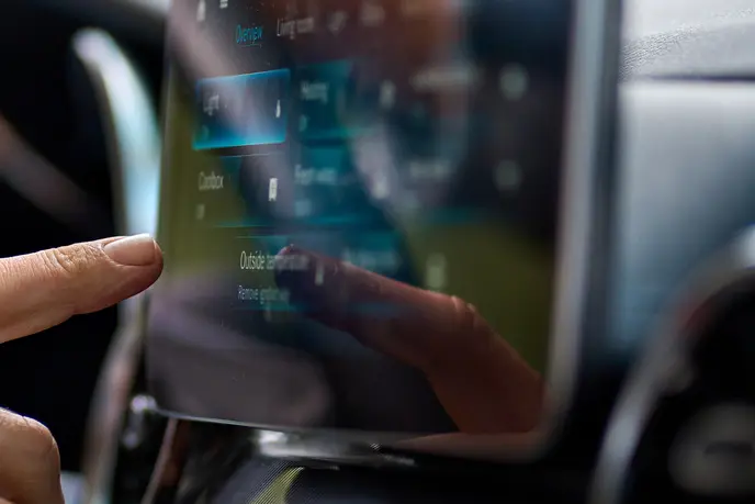 Finger touches screen in car