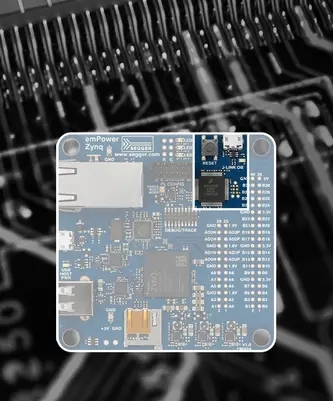 A blue circuit board identified as "emPower Zynq" featuring various electronic components, ports, and labels. The board is central in the image against a blurred dark background, highlighting its design and connections.