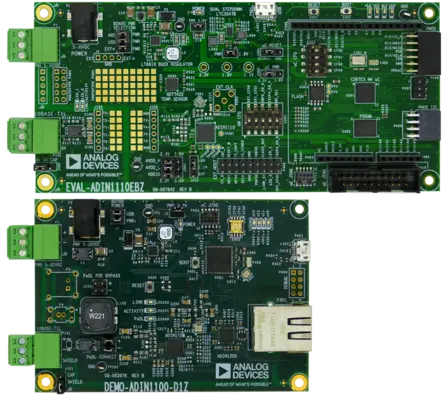 The image features two green printed circuit boards (PCBs) from Analog Devices. The top board, labeled "EVAL-ADIN1110EBZ," includes various components like capacitors and connectors. The lower board, "DEMO-ADIN1100-D1Z," displays additional electronic components and a USB port. Both boards are designed for electronic evaluations.