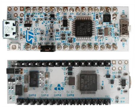 The image shows two microcontroller circuit boards stacked on top of each other. The top board features various components, including a USB port, while the bottom board has multiple pins and a central microchip. Both boards are designed for electronics prototyping and development.