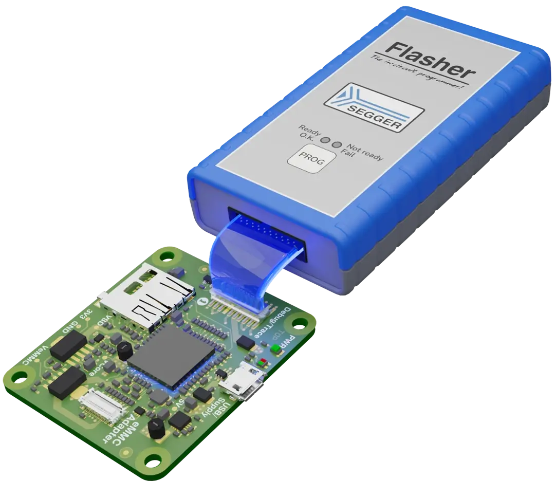 An electronic device is shown, featuring a blue and gray programmer labeled "Flasher" from SEGGER, connected via a cable to a green circuit board equipped with various components, including a microcontroller and interfaces. The setup is used for programming embedded systems.